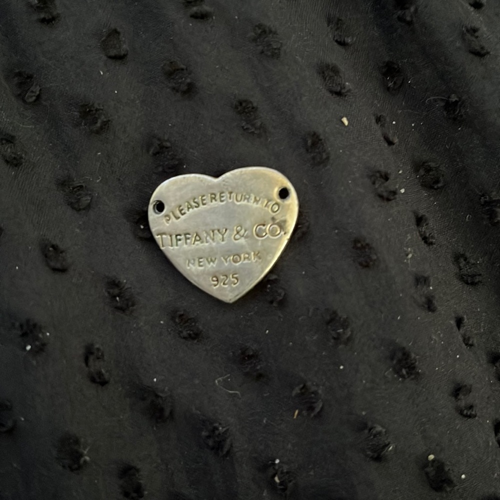 Original “return back to Tiffany & Co” new york 925 charm. (comes with chain)